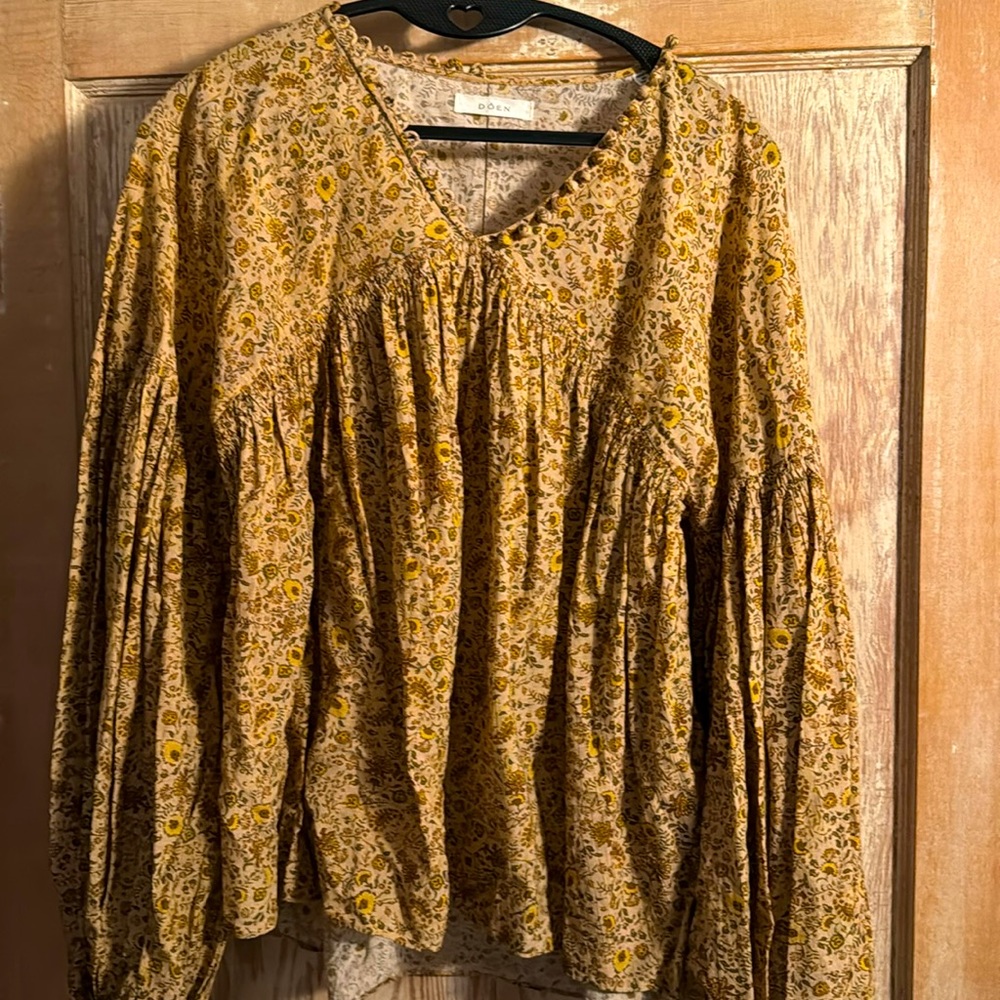 D O E N flowing cotton blouse.